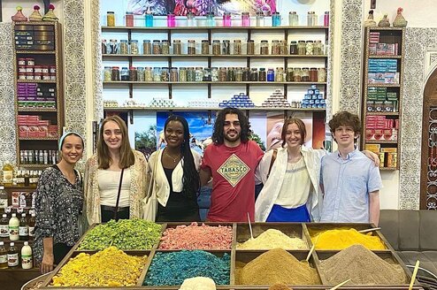 Group of 7 APA Multi-Country students at a spice market in Morocco.